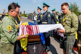 Scouts unfurl an embroidered towel