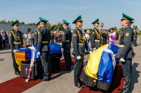 Clergymen conduct a funeral service during the solemn ceremony of meeting the coffins with the ashes of UNR Army Colonel and OUN leader Andriy Melnyk