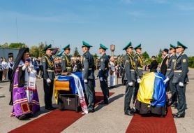 Clergymen conduct a funeral service during the solemn ceremony of meeting the coffins with the ashes of UNR Army Colonel and OUN leader Andriy Melnyk