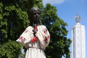 Monument to the "girl with spikelets" in an embroidered shirt