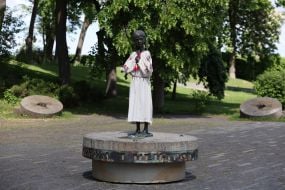 Monument to the "girl with spikelets" in an embroidered shirt