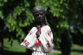 Monument to the "girl with spikelets" in an embroidered shirt