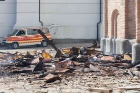 Fragments of the roof of the Assumption Cathedral of the Kyiv Pechersk Lavra on the asphalt