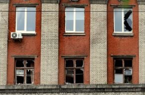 Broken windows in a building on the territory of the Oleksandr Dovzhenko National Film Studio in Kyiv