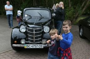 Children near a retro car