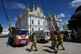 Rescuers are extinguishing a fire caused by a Russian air strike in the Kyiv Pechersk Lavra