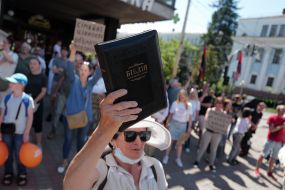 A woman holding a Bible
