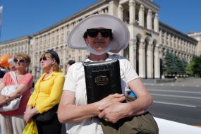 A woman holding a Bible