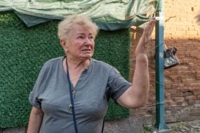 Kharkiv residents look at the aftermath of shelling