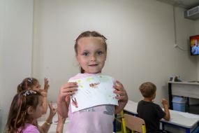 A girl in an underground kindergarten in the village of Pisochyn
