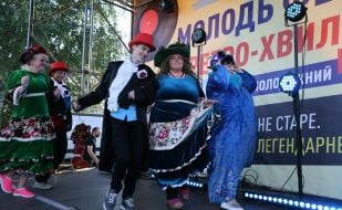 Guests of the youth festival "Retro Wave" in bright retro costumes