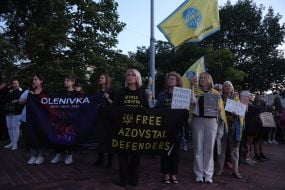 Participants of the open installation in memory of the fourth anniversary of the terrorist attack in Olenivka on Mykhailivska Square in Kyiv