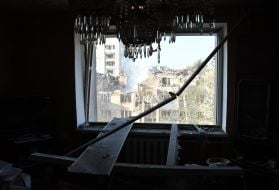 View from a broken window of a neighboring house on a residential building damaged by a missile strike in Lviv