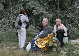 Residents of a residential building damaged by a rocket strike in Lviv evacuated