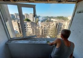 View from a broken window of a neighboring house on a residential building damaged by a missile strike in Lviv