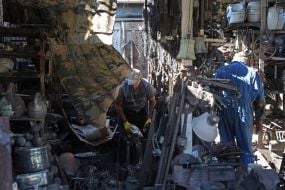Owners of retail outlets at the antique flea market on Pochaina are looking for items that survived the missile strike