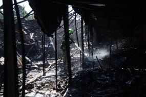 Pavilions destroyed after a missile strike on the antique flea market on Pochayna