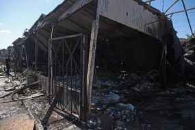 Pavilions destroyed after a missile strike on the antique flea market on Pochayna
