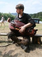 Musician with a wheeled lyre