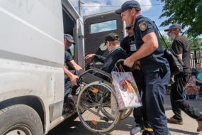 People evacuated from the Shevchenkivska community of the Kupyanskyi district at the IDP reception point in Kharkiv