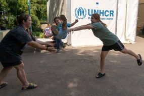 Children evacuated from the Shevchenkivska community of the Kupyanskyi district play at the IDP reception point in Kharkiv