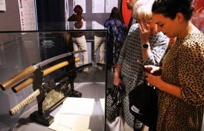 Visitors inspect a Japanese sword, nihonto, by master Munekage