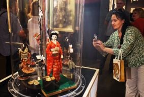 Visitors inspect the exhibition exhibits