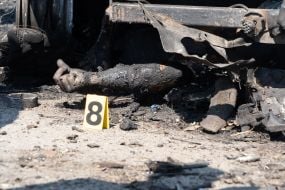 Bodies of those killed in the rocket attack on the village of Pechenigy