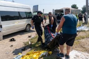 Bodies of those killed in the rocket attack on the village of Pechenigy