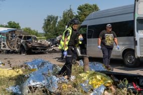 Bodies of those killed in the rocket attack on the village of Pechenigy