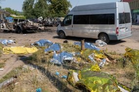 Bodies of those killed in the rocket attack on the village of Pechenigy