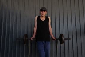 A prisoner of war lifts a barbell in one of the special camps for holding Russian prisoners of war