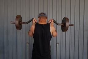 A prisoner of war lifts a barbell in one of the special camps for holding Russian prisoners of war