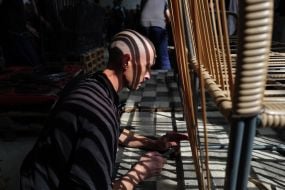 A prisoner of war works in the workshop in one of the special camps for holding Russian prisoners of war
