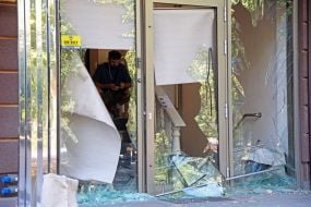 Broken glass in the windows of a house in the Obolonsky district of Kyiv after an enemy UAV crashed