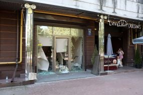 Broken glass in the windows of a house in the Obolonsky district of Kyiv after an enemy UAV crashed