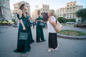 Girls advertise a new perfume store in the center of Kyiv