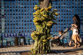 People near the Wall of Remembrance of the Fallen Defenders of Ukraine