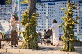 People near the Wall of Remembrance of the Fallen Defenders of Ukraine