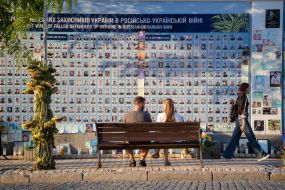 People near the Wall of Remembrance of the Fallen Defenders of Ukraine
