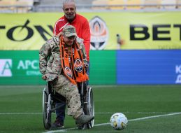 The soldier takes the ceremonial kick-off