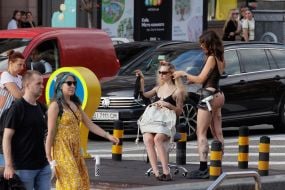 A hairdresser styles a young woman's hair in the center of Kyiv