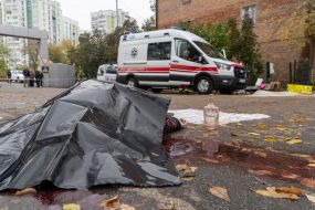 The body of a person killed in a Russian strike on a market in Kharkiv
