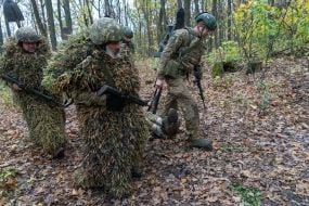 Troops from the 13th "Khartiya" Brigade of the National Guard of Ukraine conducted unit coordination training in a forested area