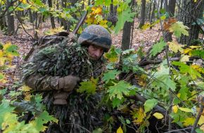 Troops from the 13th "Khartiya" Brigade of the National Guard of Ukraine conducted unit coordination training in a forested area