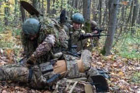 Troops from the 13th "Khartiya" Brigade of the National Guard of Ukraine conducted unit coordination training in a forested area