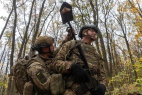 Troops from the 13th "Khartiya" Brigade of the National Guard of Ukraine conducted unit coordination training in a forested area
