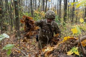Troops from the 13th "Khartiya" Brigade of the National Guard of Ukraine conducted unit coordination training in a forested area