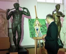 Oleksii Makeiev views an exhibition of children's artwork