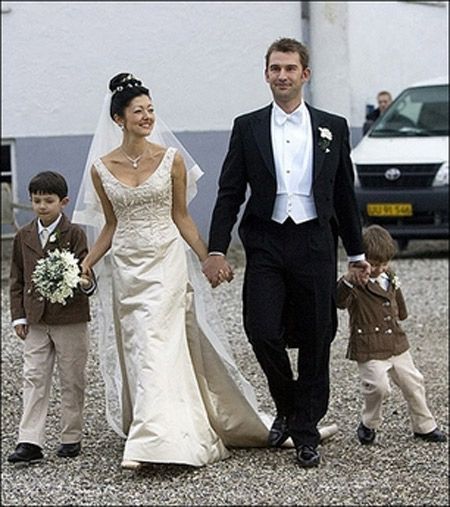 Former Danish Princess Alexandra walks with her sons Nikolai, Felix and photographer Martin Jorgensen after their wedding at Oester Egede Church. Photo AFP/SCANPIX